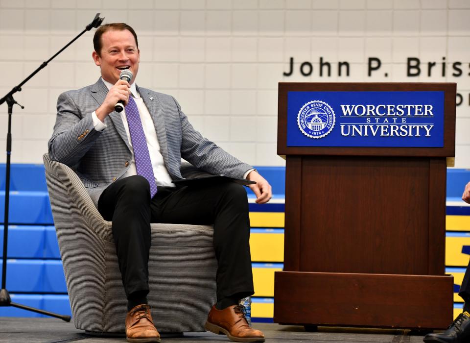 Kit Hughes, director of athletics at Holy Cross, answers questions during the third annual Worcester Sports Management Summit at Worcester State University.