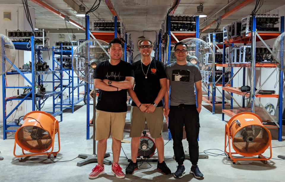 Mining.SG shifted to a new 14,000sqf space early March as part of its expansion plans and now has the capacity to hold 1,300 rigs. From left to right: Chief technology officer Dexter Ng, business partner Gerard Della Porta and chief marketing officer Syahrein Ritzwan. (PHOTO: Wong Casandra/Yahoo News Singapore)