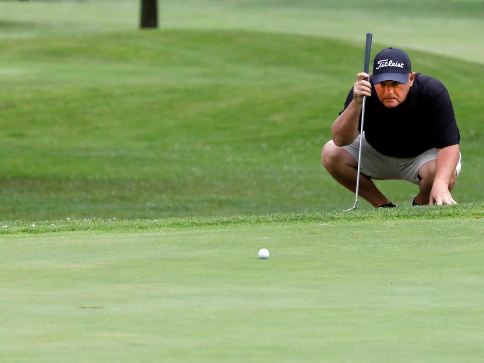 Warsaw's Brad Baker lines up a birdie putt during the first round of the 46th annual Zanesville District Golf Association Amateur tournament on Friday, June 24, 2023, at Hickory Flats Golf Course in West Lafayette, Ohio.