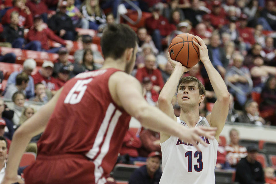 Arizona forward Stone Gettings (13) shoots near Washington State center Volodymyr Markovetskyy (15) during the second half of an NCAA college basketball game in Pullman, Wash., Saturday, Feb. 1, 2020. Arizona won 66-49. (AP Photo/Young Kwak)