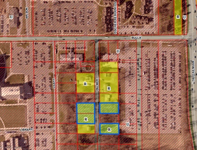 In this graphic from the Area Plan Commission, the University of Notre Dame seeks to rezone four lots it owns on Palmer Street on campus from R-1 to U-university district for the construction of parking lots.