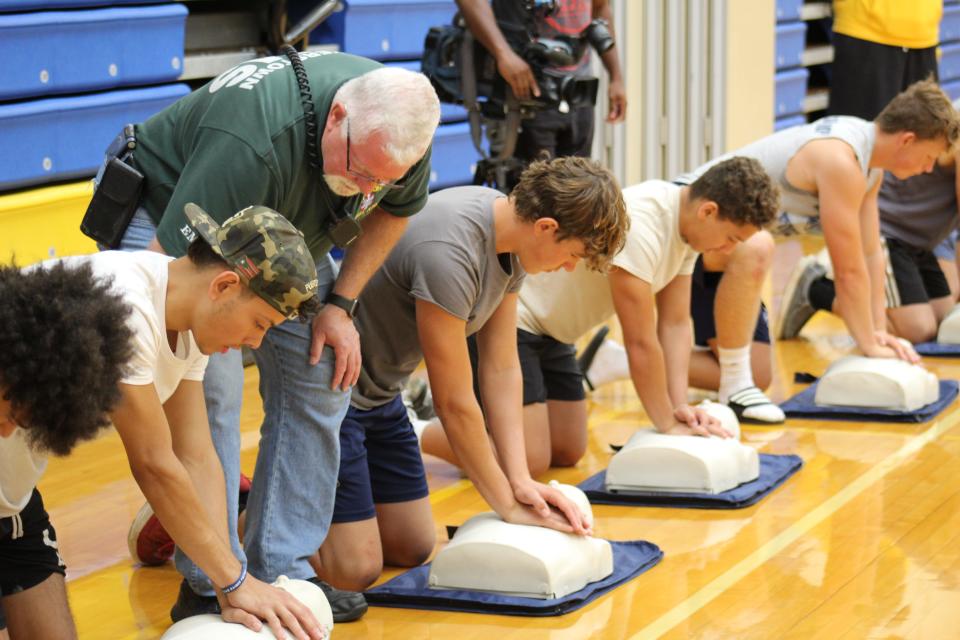 Instructors like Dave Kirchner, in green shirt, helped Eastern Lebanon County School District students with the finer details of giving CPR, like proper compression form and how to properly check for a pulse.