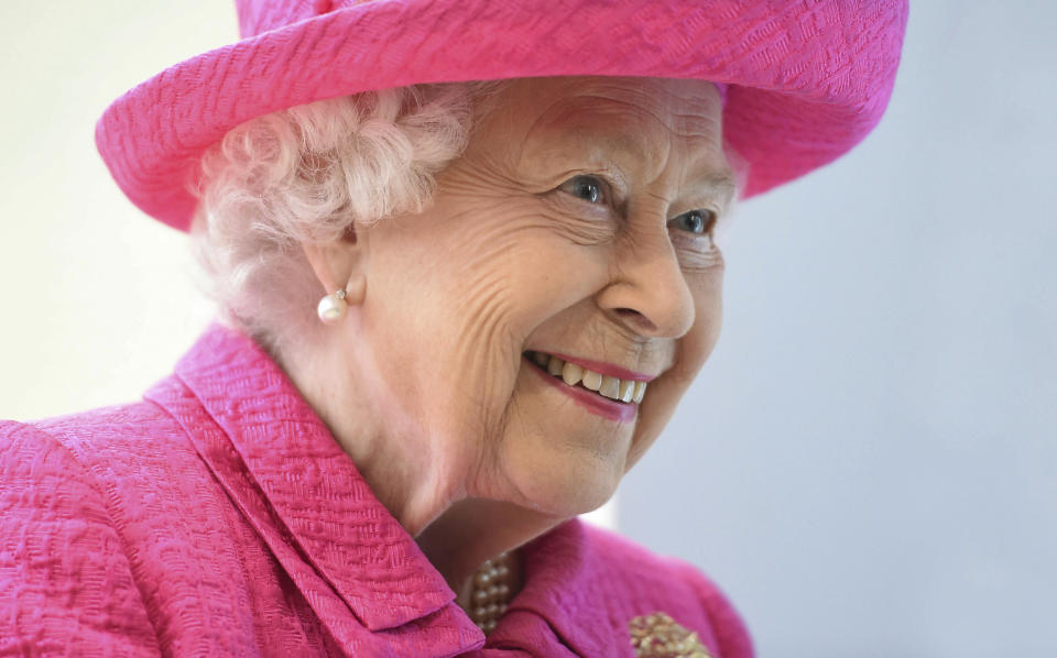 Britain's Queen Elizabeth II reacts during a visit to the Royal Papworth Hospital in Cambridge, England, Tuesday July 9, 2019. The Queen will view  some of the new state-of-the-art facilities during her visit to the newly refurbished leading heart and lung specialist Royal Papworth Hospital. (Joe Giddens/PA via AP)