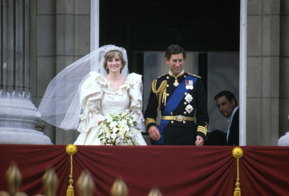 Prince Charles & Princess Diana stand on the balcony of Buckingham Palace after their wedding ceremony at St. Paul's Cathedral, London, England, July 29, 1981. 