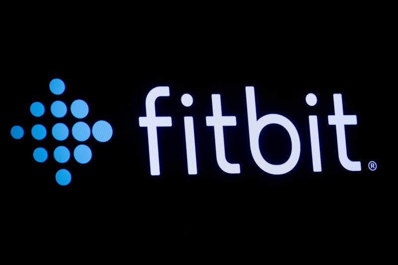 FILE PHOTO: The logo for wearable device maker Fitbit Inc. is displayed on a screen at NYSE floor in New York