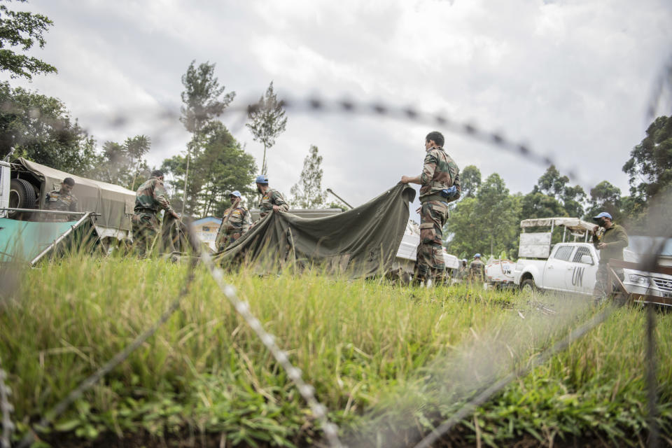 MONUSCO blue helmet deployed near Kibumba, north of Goma, Democratic Republic of Congo, Saturday Jan. 28, 2022. Thousands of people in the Democratic Republic of Congo have been displaced after they fled ongoing clashes between the Congolese army and M23 fighters this week. (AP Photo/Moses Sawasawa)