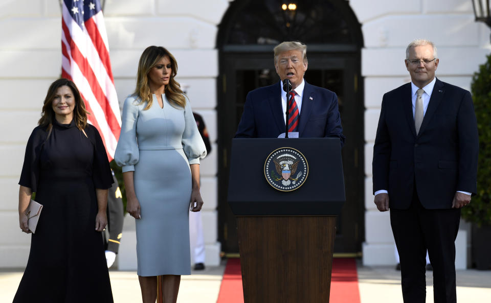 President Donald Trump speaks as he and first lady Melania Trump welcome Australian Prime Minister Scott Morrison and his wife Jenny Morrison during a state arrival ceremony on the South Lawn of the White House in Washington, Friday, Sept. 20, 2019. (AP Photo/Susan Walsh)