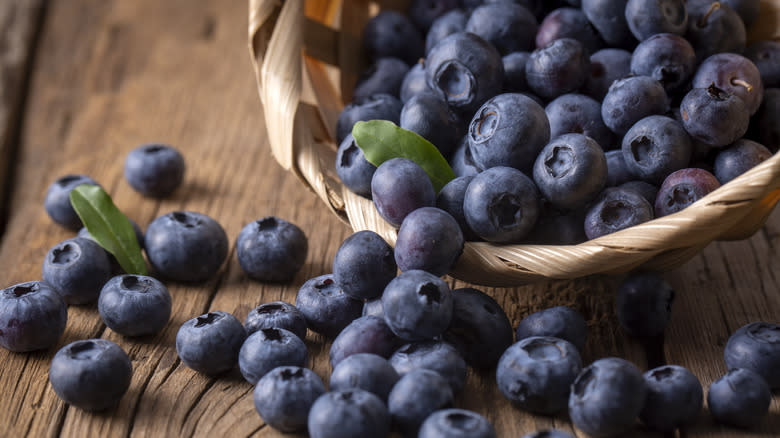 blueberries spilling from basket