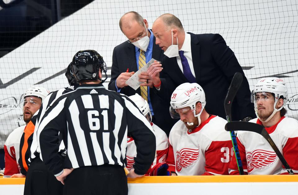 Red Wings coach Jeff Blashill, right, challenges a goal during the first period on Thursday, March 25, 2021, in Nashville, Tennessee.