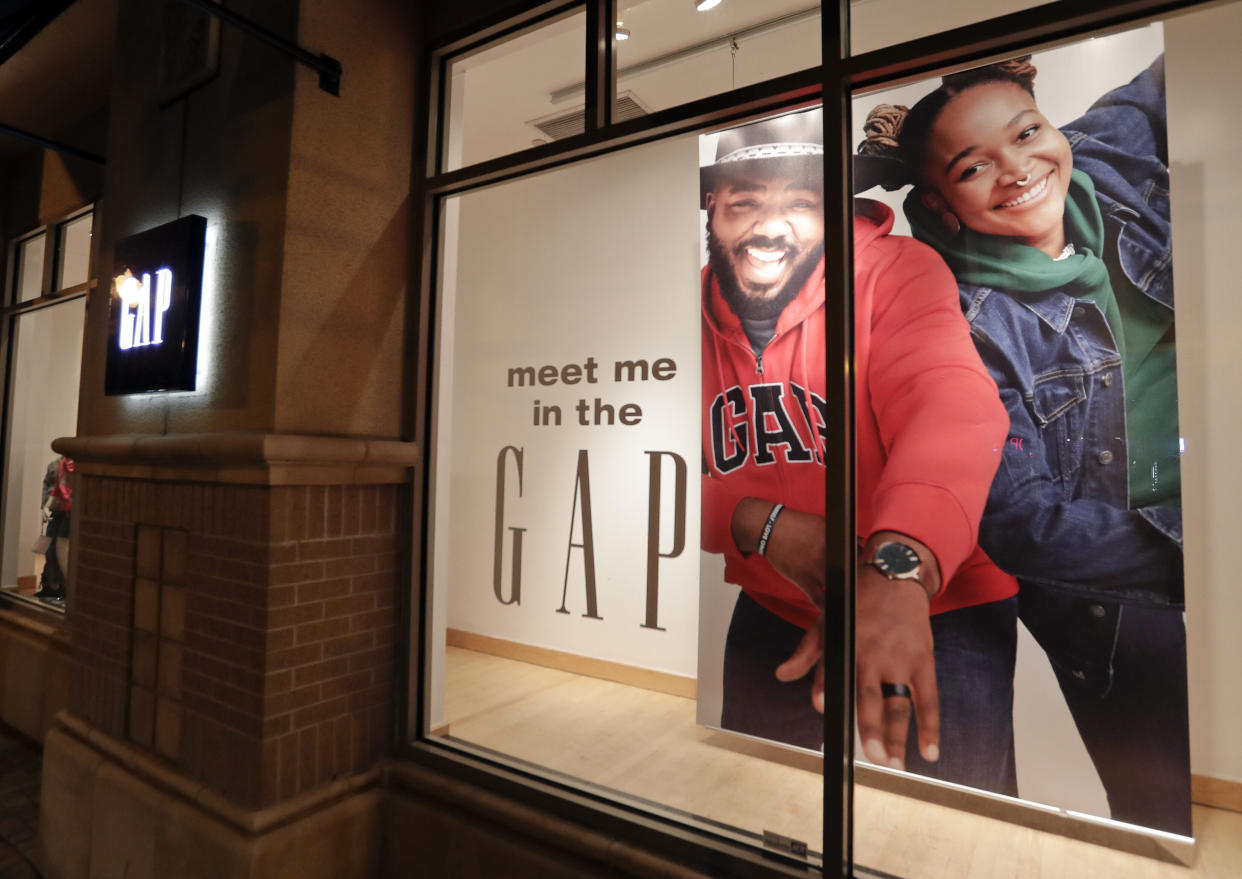 A window display at a Gap clothing store is seen Thursday, Aug. 23, 2018, in Winter Park, Fla. (AP Photo/John Raoux)