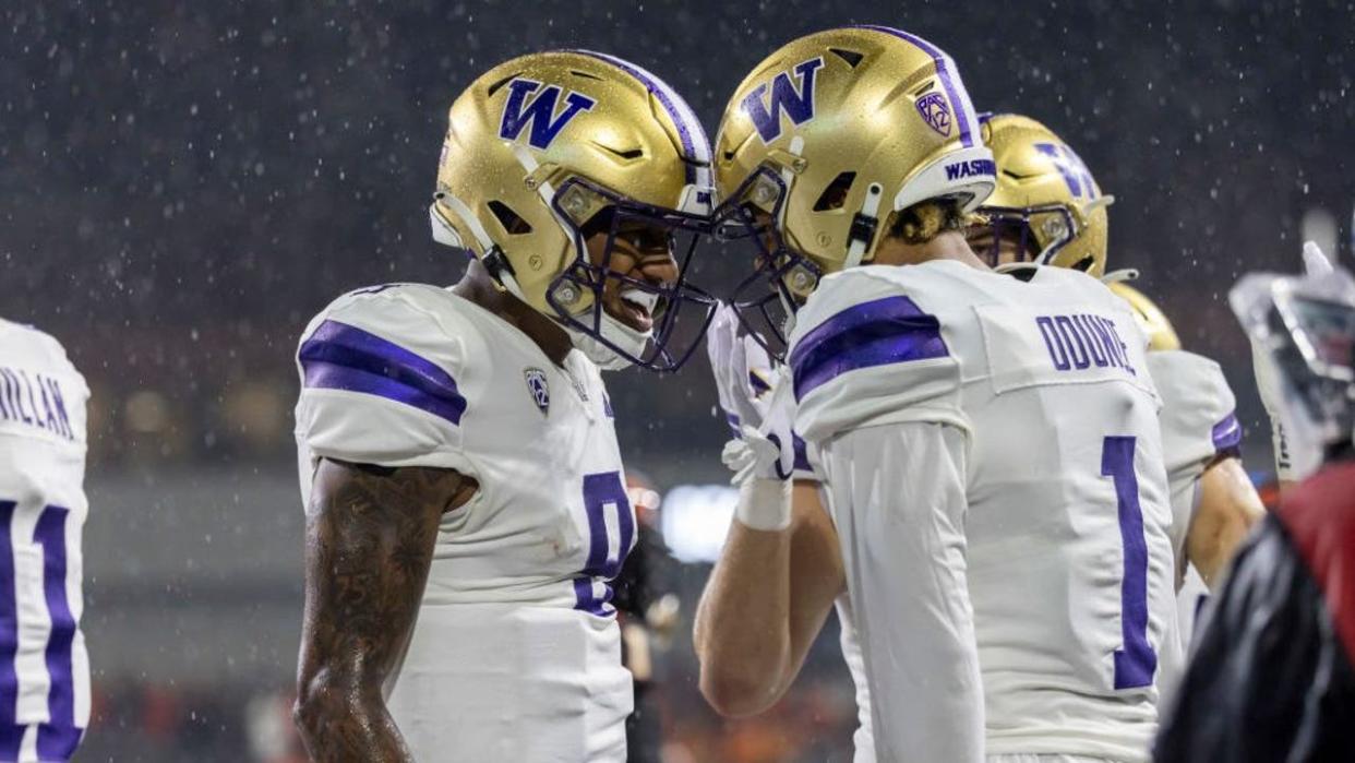 <div>CORVALLIS, OREGON - NOVEMBER 18: Wide receiver Rome Odunze #1 of the Washington Huskies celebrates his touchdown catch with Michael Penix Jr. #9 of the Washington Huskies during the first half against the Oregon State Beavers at Reser Stadium on November 18, 2023 in Corvallis, Oregon.</div> <strong>(Tom Hauck / Getty Images)</strong>