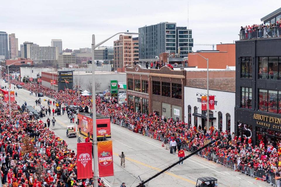 Kansas City Chiefs fans cheer as the team progresses down Grand Boulevard during the Super Bowl victory parade on Wednesday, Feb. 15, 2023. Messenger Coffee expects to do booming business again, inside and on the roof. Nick Wagner/nwagner@kcstar.com
