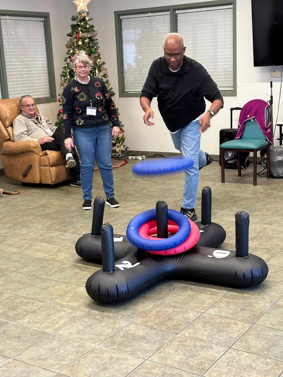 A friendly game of ring toss is among the fun activities at Coleman Adult Day Services in Ravenna.