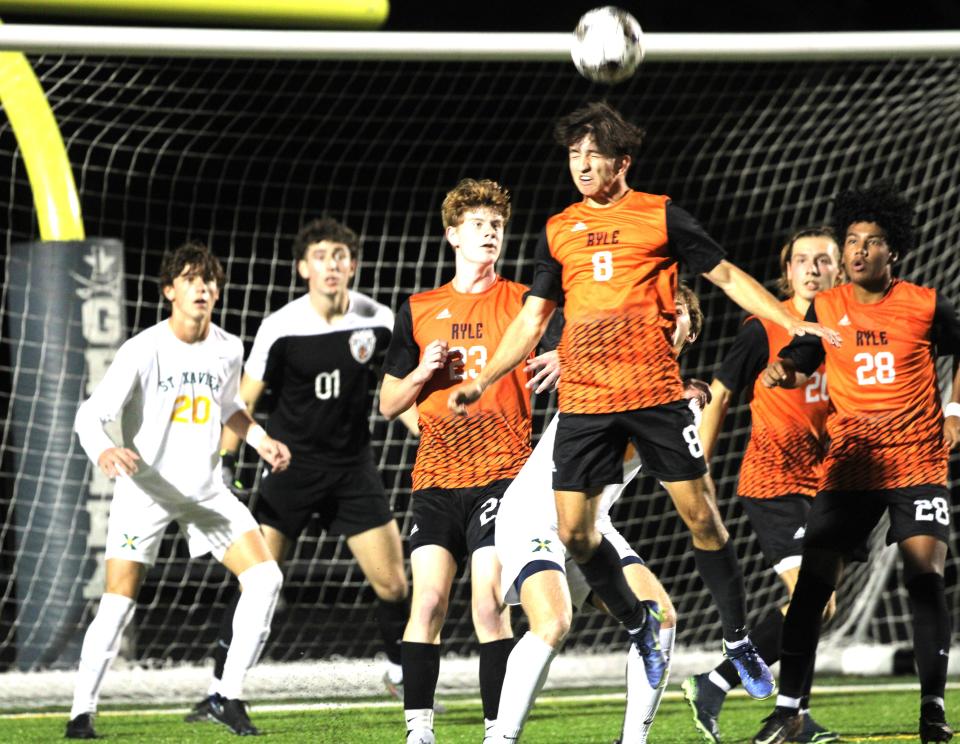 Ryle senior Anes Smajlovic heads the ball out of trouble as Ryle and St. Xavier faced off in the KHSAA boys soccer state semifinals Oct. 25, 2023 at Lafayette High School, Lexington, Ky.