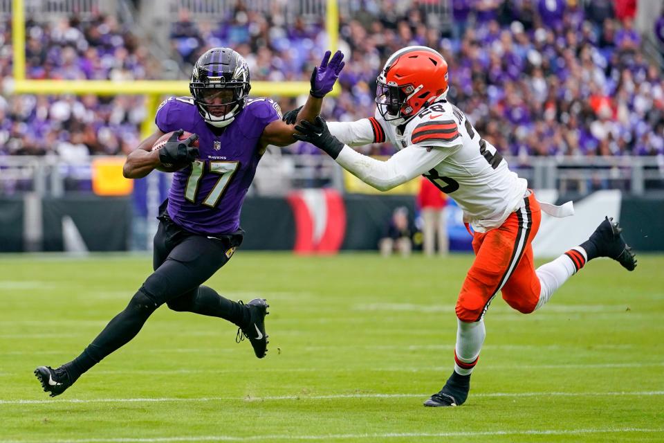 Ravens running back Kenyan Drake is stopped by Cleveland Browns linebacker Jeremiah Owusu-Koramoah after a second-half catch, Sunday, Oct. 23, 2022, in Baltimore.