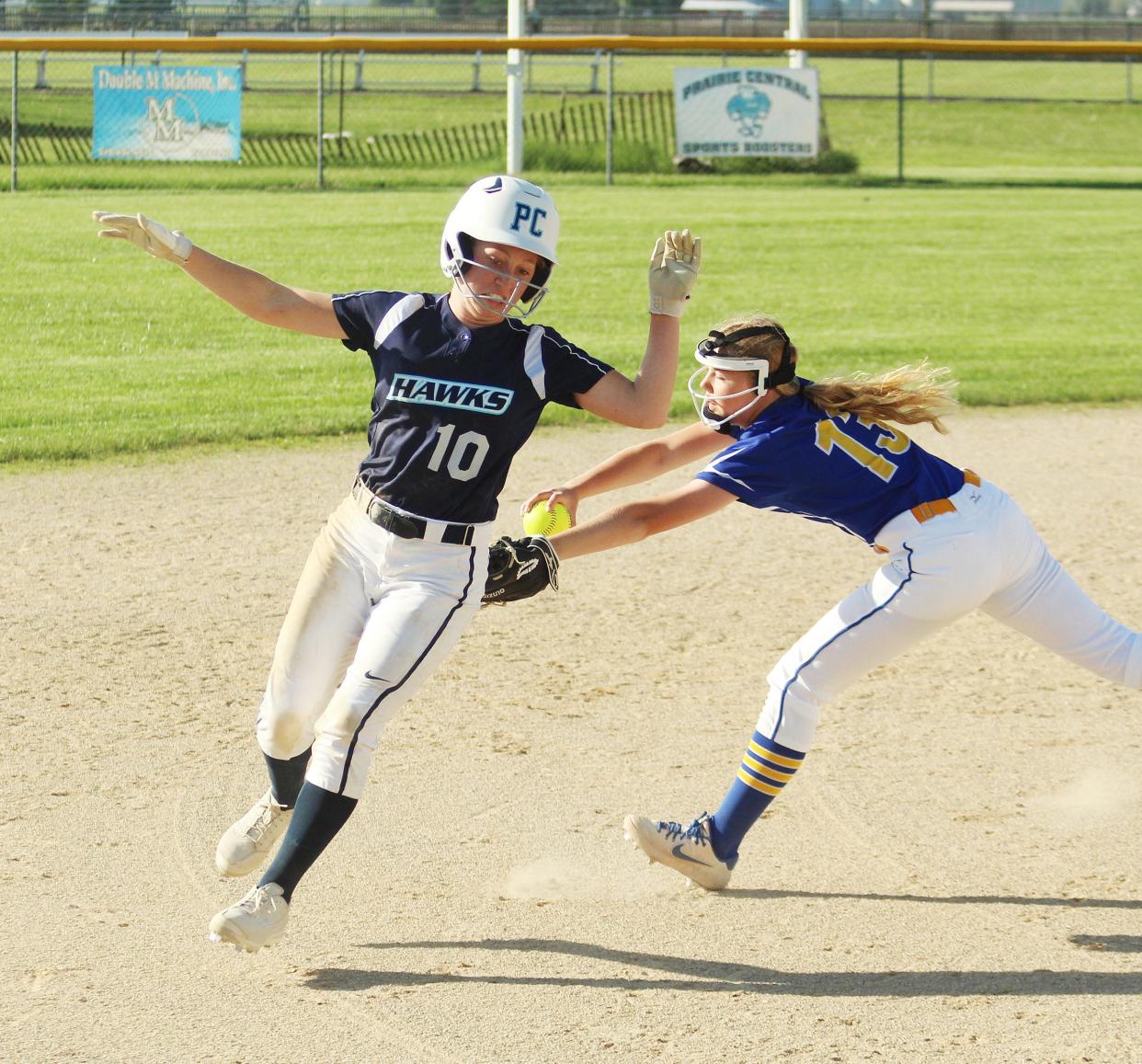 Prairie Central's Kenna Skaggs avoids being tagged as she races to third base Monday. Skaggs scored in the bottom of the seventh inning with the game's only run to send the Hawks to the regional semifinal round with a 1-0 win over Paxton-Buckley-Loda.