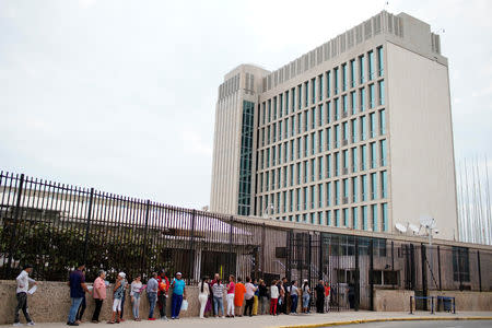 People wait in line to enter the U.S. embassy in Havana, Cuba, March 18, 2019. REUTERS/Alexandre Meneghini