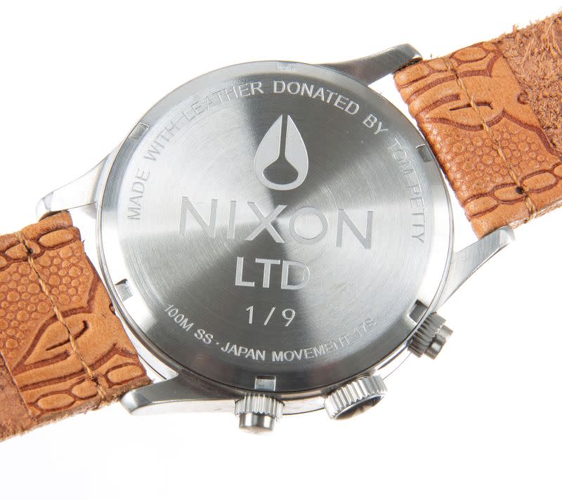 A Nixon Ltd custom limited edition western motif watch, engraved ''made with leather donated by Tom Petty'' made from the late musician’s personal guitar strap, is seen in an undated photo before an auction online in Los Angeles