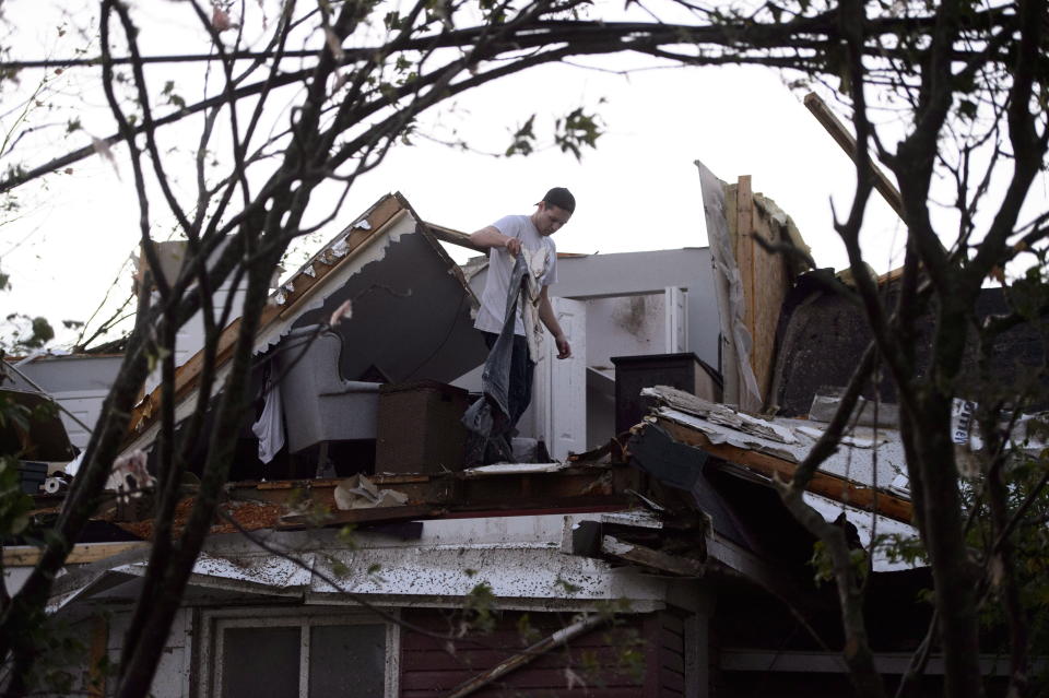 <p>People collect personal effects from damaged homes following a tornado in Dunrobin, Ontario west of Ottawa on Friday, Sept. 21, 2018. A tornado damaged cars in Gatineau, Que., and houses in a community west of Ottawa on Friday afternoon as much of southern Ontario saw severe thunderstorms and high wind gusts, Environment Canada said. (Photo from Sean Kilpatrick/The Canadian Press) </p>