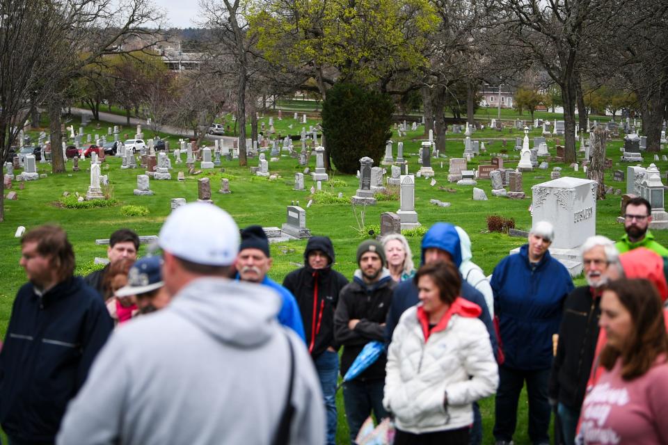 Guests listen to Jeff Kluever speak during a Civil War-themed walking tour of Des Moines' historic Woodland Cemetery.