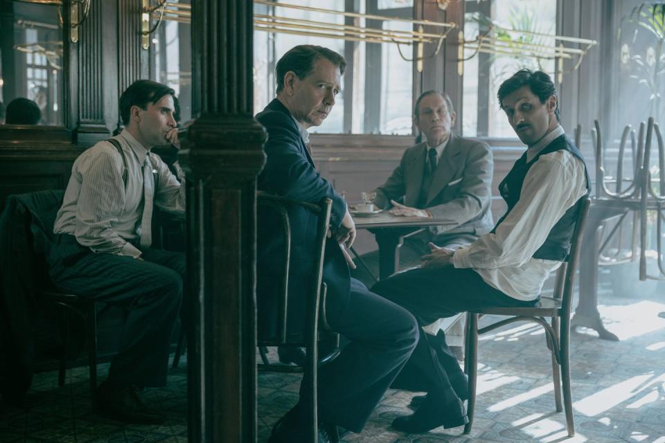 a group of men sitting at a table