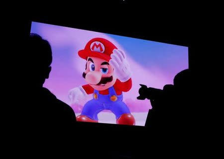 Nintendo's game character Super Mario is seen on a screen at the presentation ceremony of Nintendo's new game console Switch in Tokyo, Japan January 13, 2017. REUTERS/Kim Kyung-Hoon/Files