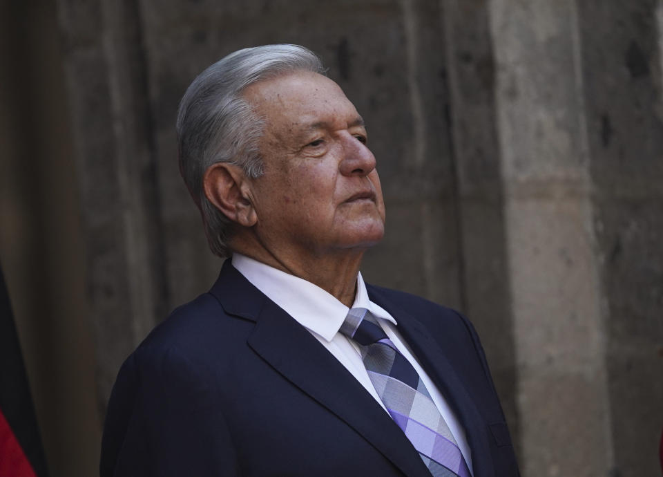 FILE - Mexican President Andres Lopez Obrador stands at the National Palace during a welcome ceremony for Germany's President Frank-Walter Steinmeier in Mexico City,, Sept. 20, 2022. López Obrador said Friday, Oct. 7 he has chosen the head of the country’s tax agency to fill the cabinet-level post of secretary of the economy. (AP Photo/Marco Ugarte, File)