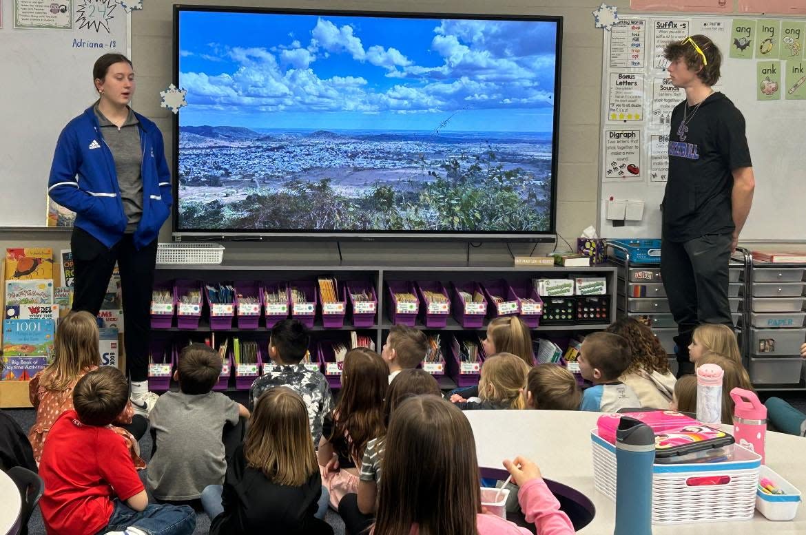 Student missionaries Marisa Varner and Matt Warder give a presentation to first-graders at Lake Center Christian School about their upcoming Dominican Republic mission trip. The classroom “adopted” the two seniors to provide them with encouragement as they prepare to serve.