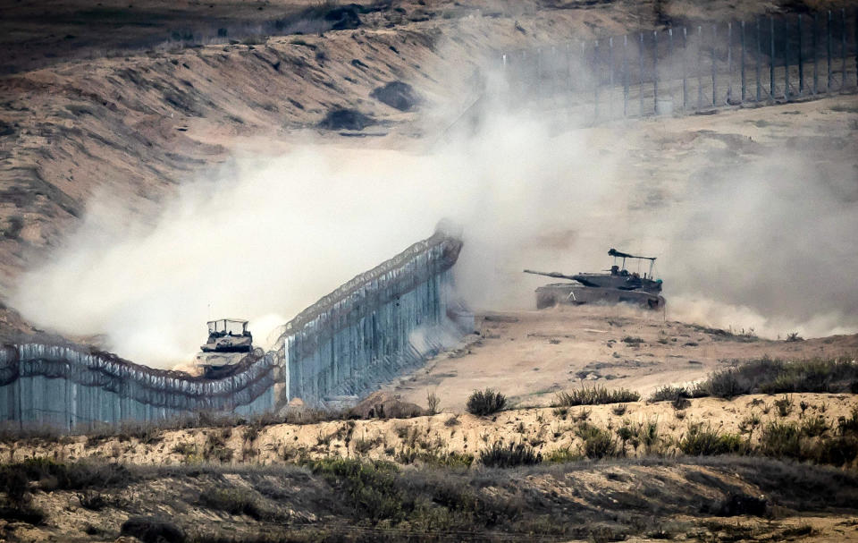 Israeli tanks along the border fence with Gaza. (Fadel Senna / AFP - Getty Images)