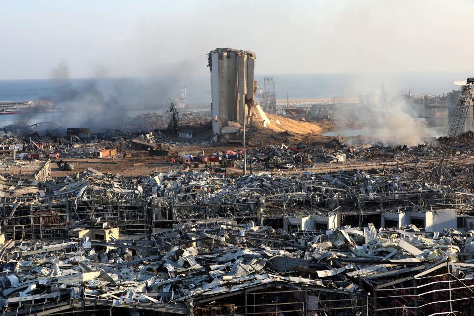 TOPSHOT - A view shows the aftermath of yesterday's blast at the port of Lebanon's capital Beirut, on August 5, 2020. - Rescuers worked through the night after two enormous explosions ripped through Beirut's port, killing at least 78 people and injuring thousands, as they wrecked buildings across the Lebanese capital. (Photo by Anwar AMRO / AFP) (Photo by ANWAR AMRO/AFP via Getty Images)