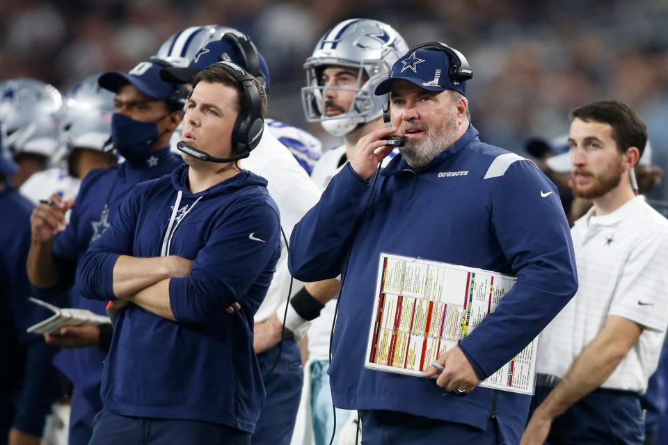 Dallas Cowboys offensive coordinator Kellen Moore (left) stands next to head coach Mike McCarthy.