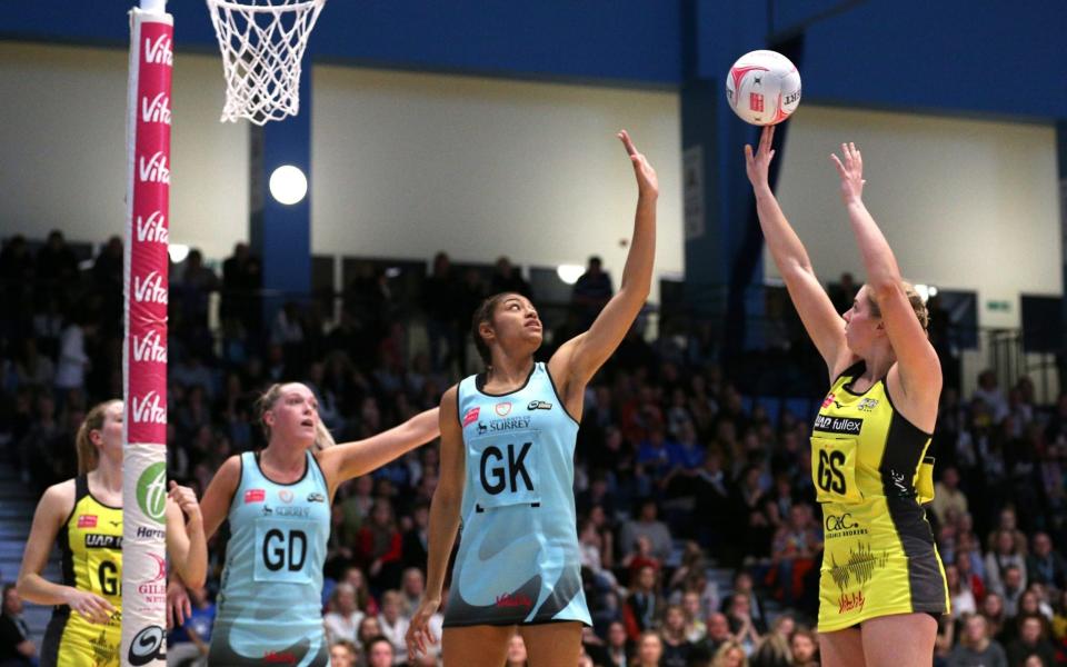 Surrey Storm's Lorraine Kowalewska (left) and Manchester Thunder's Eleanor Cardwell battle for the ball during the Vitality Netball Super League match  - PA