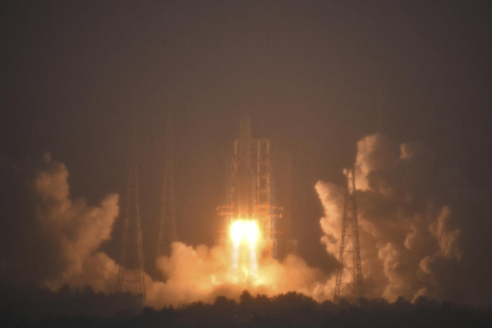 FILE -In this photo provided by China's Xinhua News Agency, a Long March-5 rocket, carrying the Chang'e-6 spacecraft, blasts off from its launchpad at the Wenchang Space Launch Site in Wenchang, south China's Hainan Province, May 3, 2024. China's Chang'e 6 probe returned on Earth on Tuesday with rock and soil samples from the little-explored far side of the moon in a global first.The probe landed in northern China on Tuesday afternoon in the Inner Mongolian region. (Guo Cheng/Xinhua via AP, File)