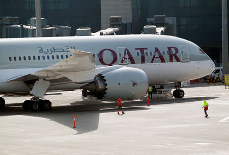 FILE PHOTO: A Qatar Airways aircraft is seen at Hamad International Airport in Doha, Qatar, June 7, 2017. REUTERS/Naseem Zeitoon