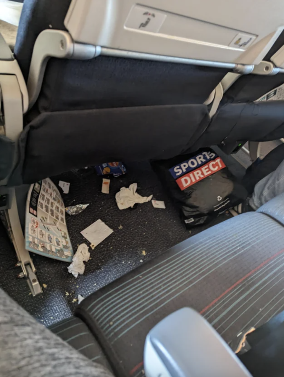 trash on the floor of a plane