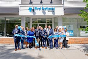 Christopher Becker, President and CEO cuts the ribbon on First National Bank LI’s newly relocated Port Jefferson location in celebration with team members. Pictured front row left to right: Chris Hilton, EVP Chief Lending Officer; Robert Grady, SVP Director of Middle Market Lending; Fatima Latif, AC Universal Banker; Jaqueline Brown, SVP Branch District Manager; Tony Gitto, Principal at The Gitto Group; Christopher Becker, President and CEO; John Rate Jr., VP Branch Manager; Janet Verneuille, EVP Chief Risk Officer; Carrie Genoino, First VP Director of Marketing and Public Relations; Annie Khan, Universal Banker I.