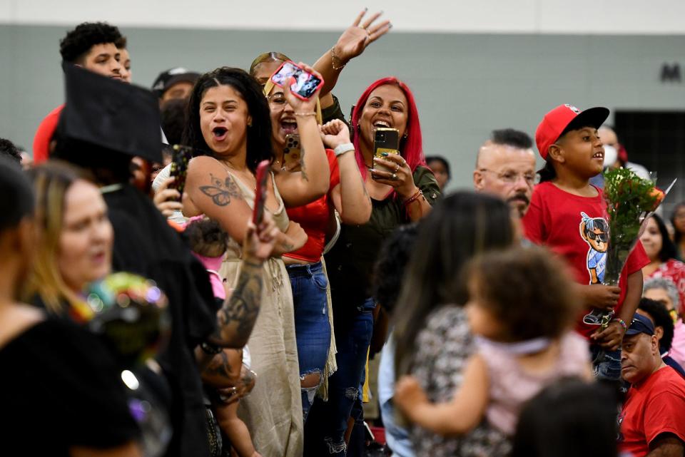 WORCESTER - Family members cheer as graduates proceed to North High's commencement at the DCU Center Wednesday, June 8, 2022.