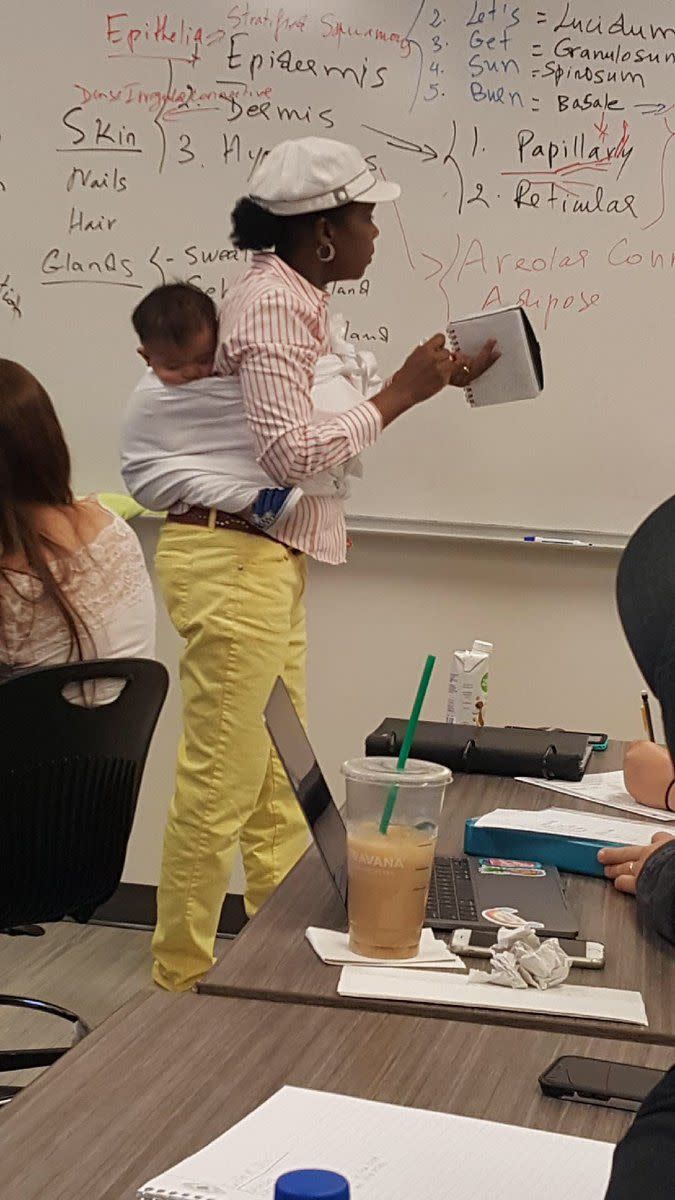 Ramata Cissé was photographed holding her student's baby during a three-hour class after her student couldn't find a babysitter. Source: Anna Cissé/Twitter