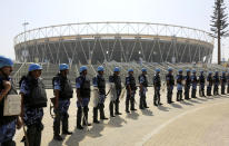 FILE - In this Feb. 21, 2020, file photo, Rapid Action Force (RAF) personnel stand guard at the Sardar Patel stadium ahead of the visit of U.S. President Donald Trump in Ahmadabad, India. President Donald Trump is ready for a king's welcome as he head to India on Sunday for a jam packed two-day tour. The visit will feature a rally at one of the world's largest stadiums, a crowd of millions cheering him on and a lovefest with a like-minded leader during an election year. (AP Photo/Ajit Solanki, File)