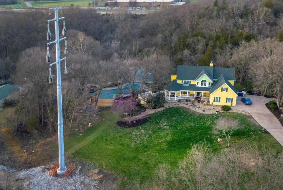 Twenty-one trees, including an 80-year-old oak, were cut to stumps to install a 100-foot tall power pole in the front yard of Michael and Diane Olson of De Soto. “It was the centerpiece of our yard. We had a gorgeous yard. I mean, really,” she said. Tammy Ljungblad/Tljungblad@kcstar.com