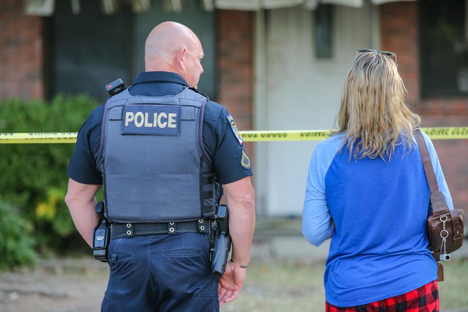 The homeowner stands outside her rental property as Broken Arrow police investigate on Friday in a case of a possible murder-suicide from Thursday in Broken Arrow.