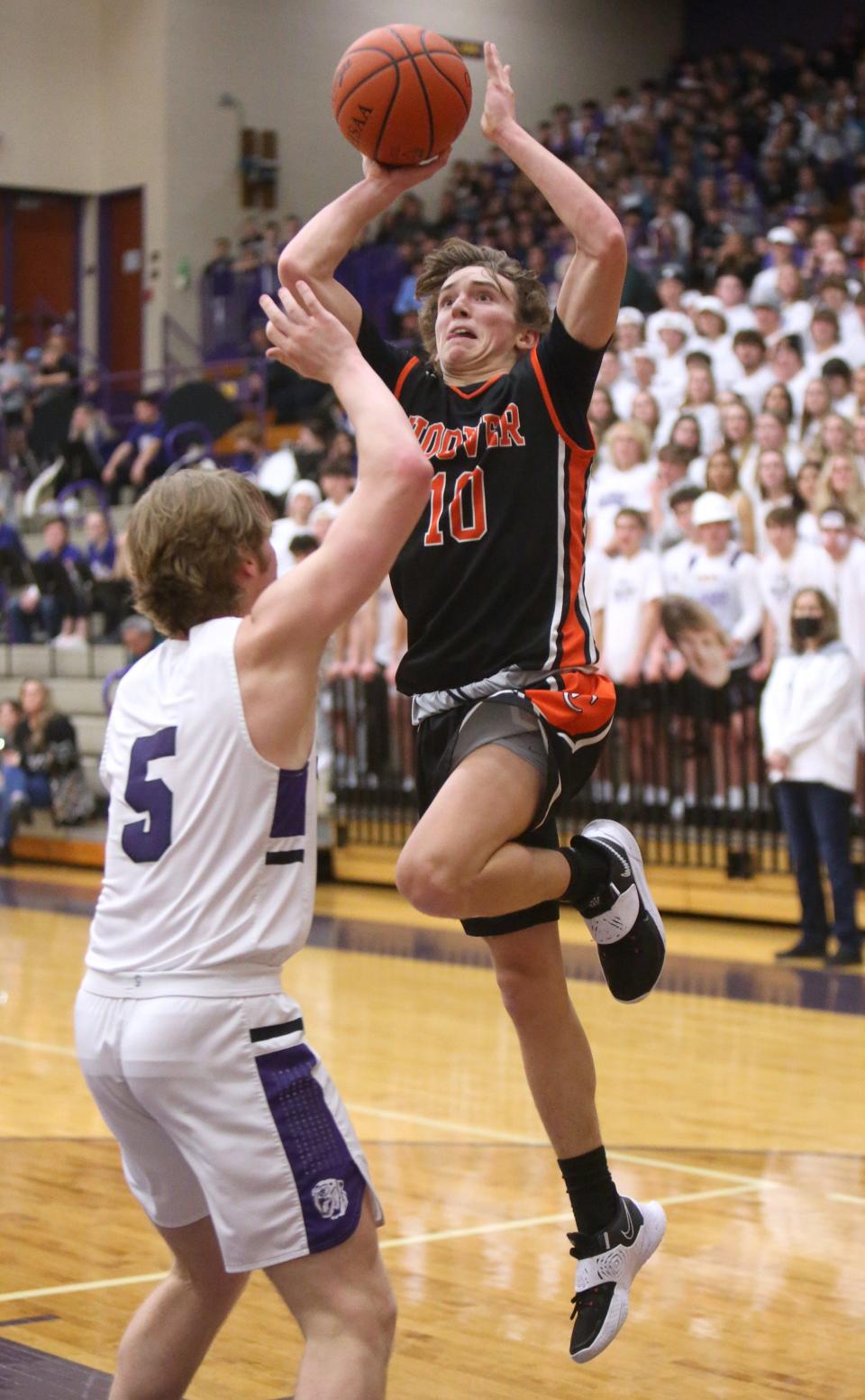 Wesley Collins, 10, of Hoover flies to the basket while being  guarded by Ben Sullivan, 5, of Jackson during their game at Jackson on Friday, Jan. 14, 2022.