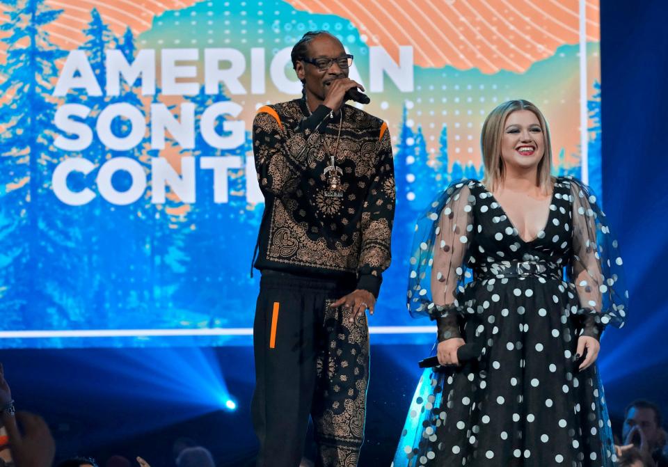 From left, Snoop Dogg and Kelly Clarkson, hosts of the new series "American Song Contest," appear on the premiere episode Monday, March 21, 2022.