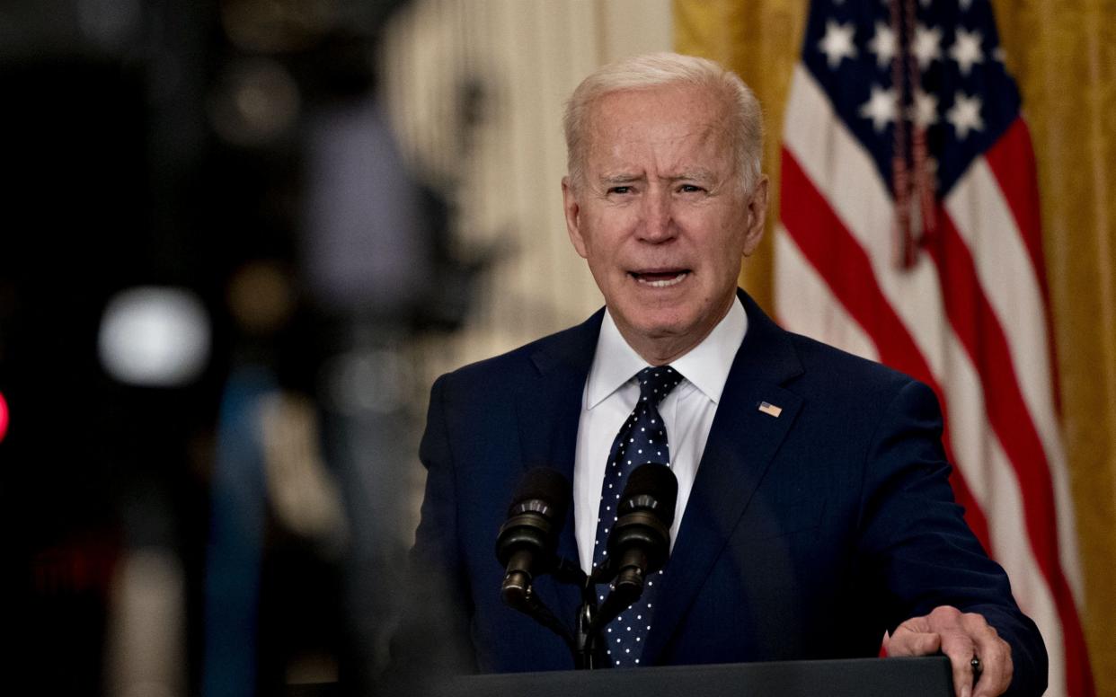 Joe Biden announced sanctions on Russia on Thursday for its election meddling and cyber attacks - BLOOMBERG