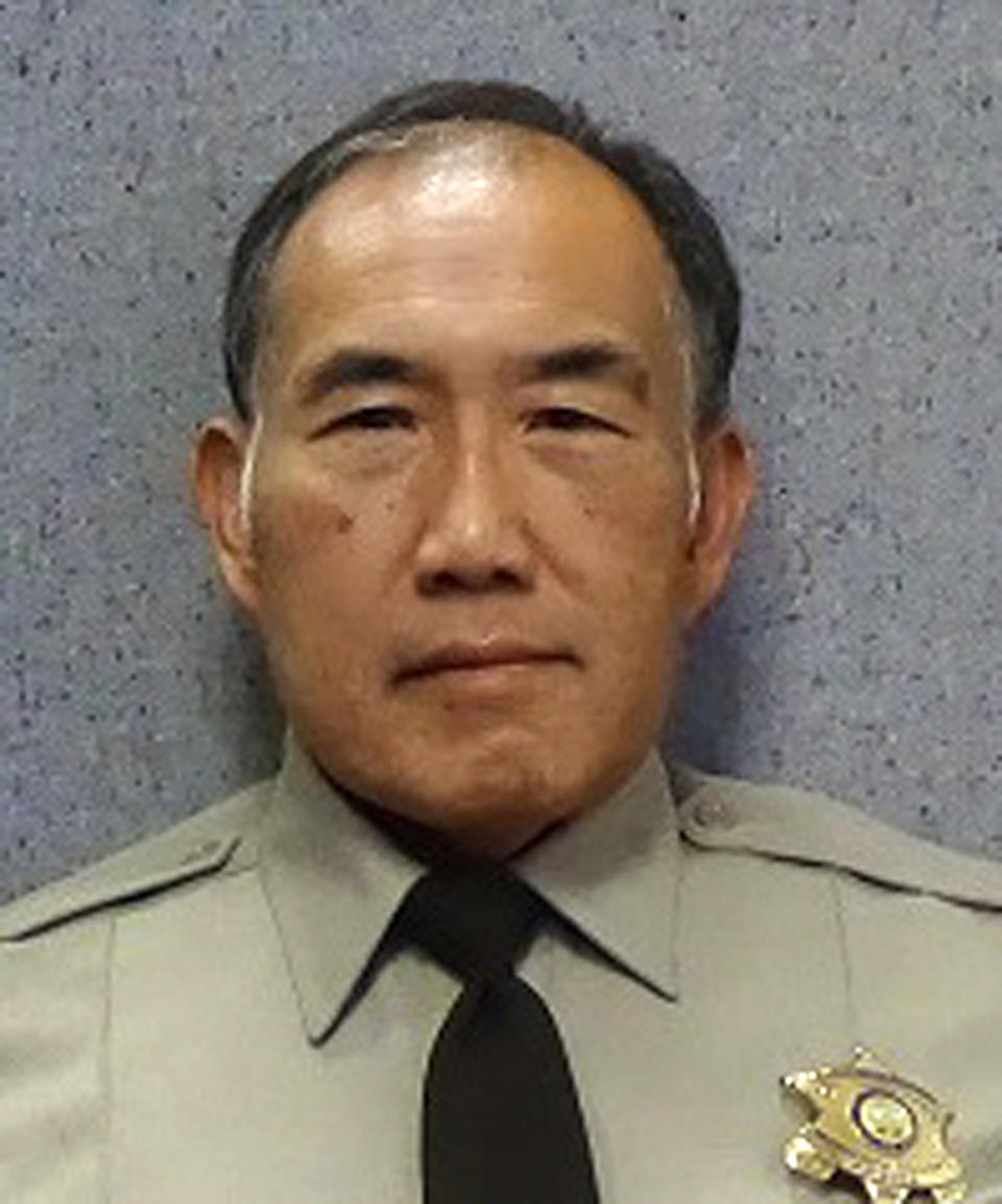 In this undated photo released by the Maricopa County Sheriff's Office is Officer Gene Lee. Authorities say Lee, a Phoenix area jail officer who was comatose after being attacked by an inmate has died. Maricopa County Sheriff Paul Penzone said 59-year-old Daniel Davitt attacked Officer Gene Lee without provocation Tuesday, Oct. 29, 2019. He said Lee was grabbed by the throat from behind and knocked to the ground. Penzone said Lee's head hit the cement floor and he never regained consciousness. Davitt faces sex crime charges involving children and is representing himself. (Maricopa County Sheriff's Office via AP)