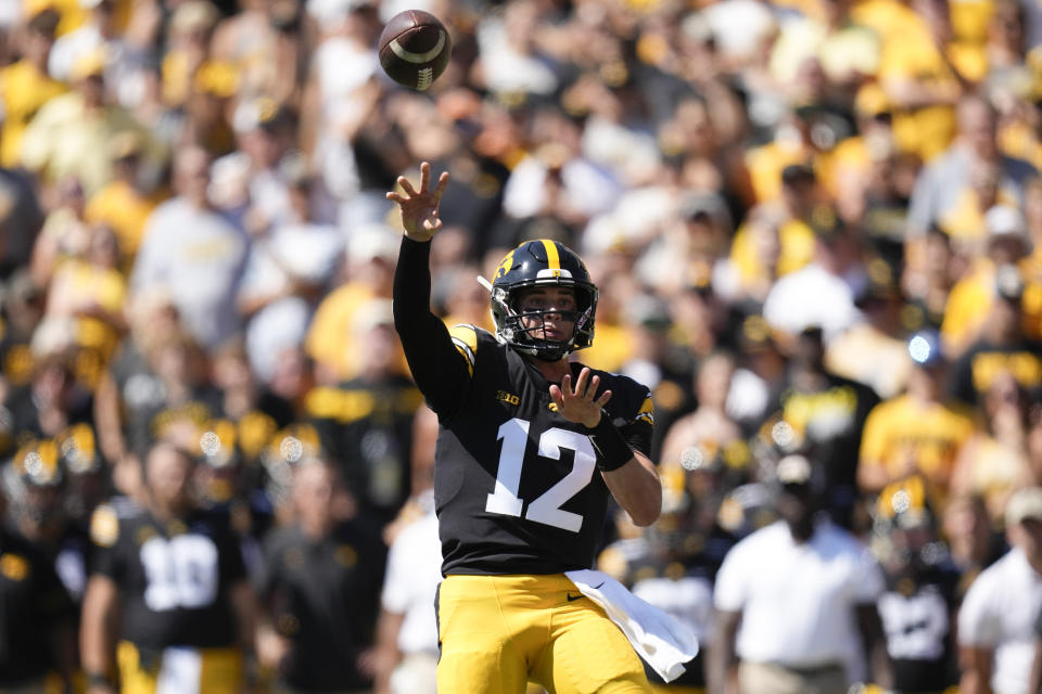 Iowa quarterback Cade McNamara (12) throws a pass during the first half of an NCAA college football game against Utah State, Saturday, Sept. 2, 2023, in Iowa City, Iowa. (AP Photo/Charlie Neibergall)