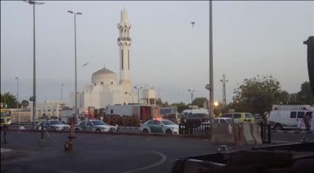 General view of security personnel in front of a mosque as police stage a second controlled explosion, after a suicide bomber was killed and two other people wounded in a blast near the U.S. consulate in Jeddah, Saudi Arabia, in this still frame taken from video July 4, 2016. REUTERS/REUTERS TV