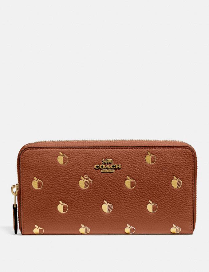 Accordion Zip Wallet With Apple Print is on sale for Black Friday at Coach, $150 (originally $250). 