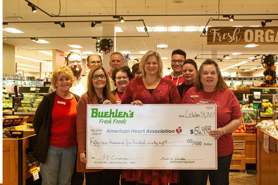 Buehler's Fresh Foods presents check to the American Heart Association.
