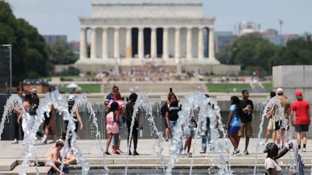 PHOTO: Visitors and tourists to the World War II Memorial seek relief from the hot weather in the memorial's fountain, July 3, 2023, in Washington, D.C. (Kevin Dietsch/Getty Images)